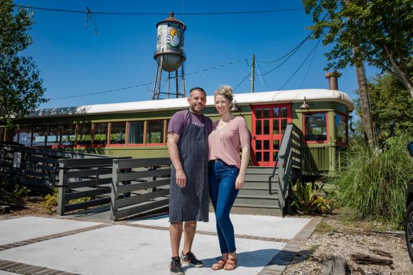 Keith and Nealy Frentz of Lola Restaurant with their train car dining room